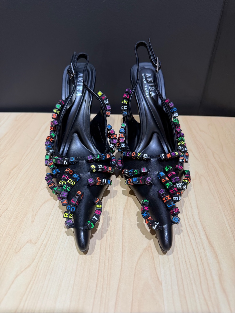 AKIRA Black Pointed Slingback Heels with Multicolored Letter Beads